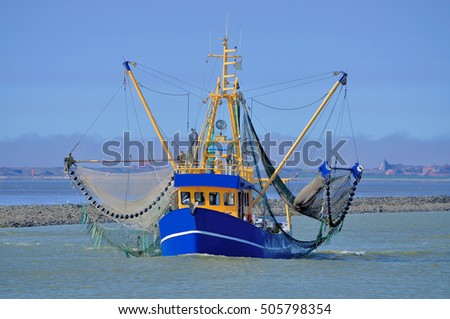 Crab Fishing Trawler in East Frisia at North Sea near Greetsiel,Lower saxony,Germany Royalty-Free Stock Photo #505798354