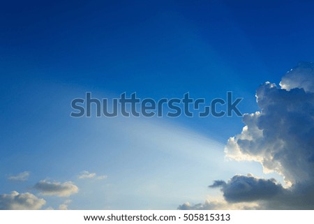 light rays explosion on clear blue sky with cloud