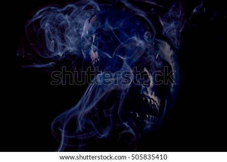 Scary Halloween skull bones with smoke