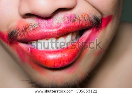 Mouth stained the color of the lipstick with a smile.