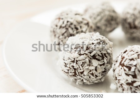Unsweetened coconut energy bites with cocoa