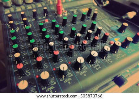Mixing audio on desk for music with lighting effect,entertainment themes