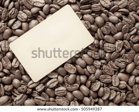Coffee beans with blank frame card for indcription flyer design.