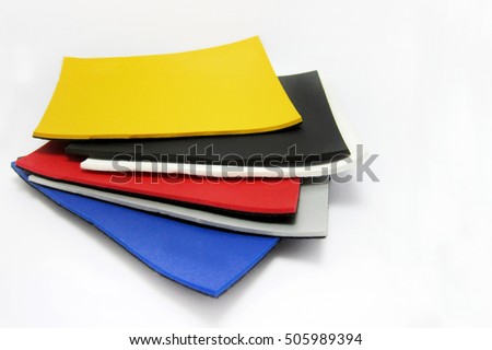Different plastic material samples on white background