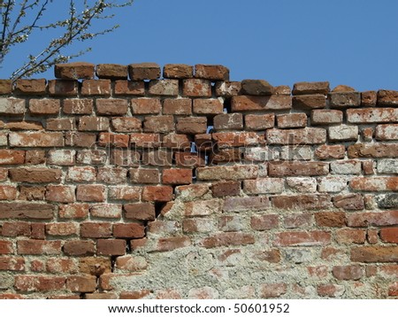 old broken wall of red brick for background