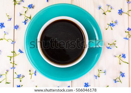 Cup of Coffee with Flowers. Studio Photo
