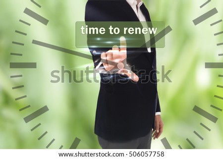 business, technology, internet and networking concept - businessman pressing time to renew  button on virtual screens, blurred of green nature outdoor bokeh background