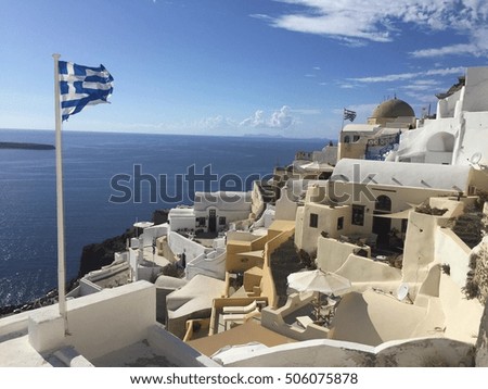 Greek flag over Santorini