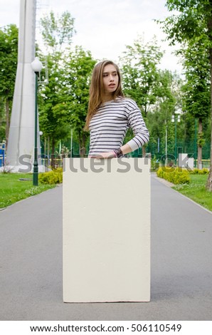 Young girl with the white banner in the city