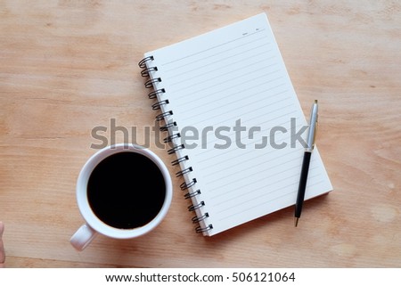  blank notebook on wood textures