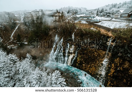 A scenic view of Turquoise waterfall of Shirahige at Biei, Hokkaido, Japan. This picture was taken during winter.