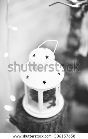 White and black photo of New Year Holiday Celebration Christmas decorations with red balls lantern on fir tree background, white candles decor, Xmas, Studio, Design, Production, Texture, Objects, 2017