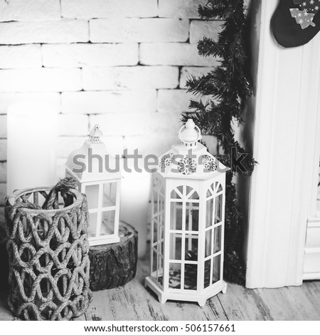 White and black photo of New Year Holiday Celebration Christmas decorations with lantern on fir tree background, white candles decor, Xmas, Studio, Stock, Design, Production, Texture, Objects, 2017