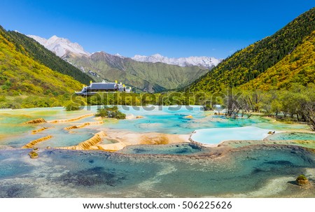 Scenical Huanglong area in Sichuan province, China, known for its colorful pools formed by calcite deposits. Pictured here is the Multi-Colored Pond situated at 3500m altitude.