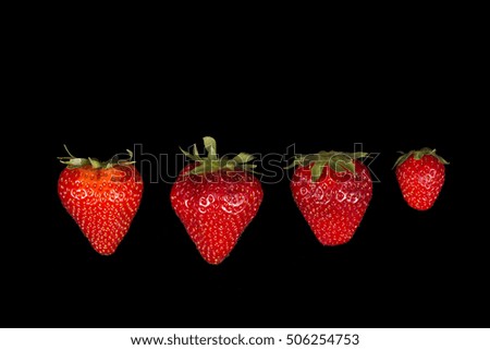 Attractive strawberry on a black background
