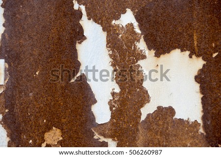 Corroded white metal background. Rusted white painted metal wall. Rusty metal background with streaks of rust. Rust stains. The metal surface rusted spots. Rusty corrosion.