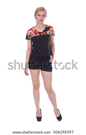 pretty young girl wearing black flower printed top and black shorts