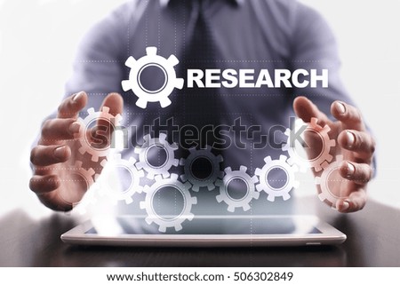 Businessman is using tablet pc and selecting research
