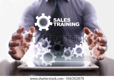 Businessman is using tablet pc and selecting sales training