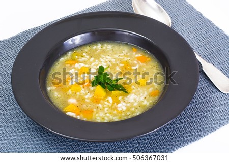 Chicken soup with rice and vegetables Studio Photo