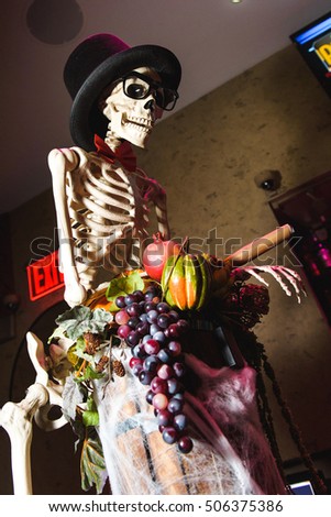 Skeleton in a black hat. Decorations for Halloween