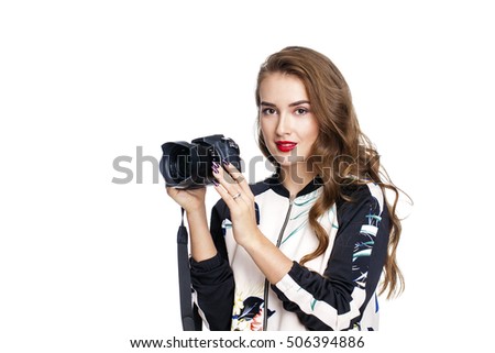 Young cheerful brunette woman taking a picture over white background 