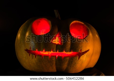 Halloween scary face pumpkin on black background