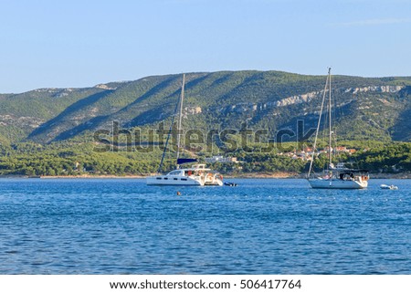 Landscape photo of sailboats on adriatic blue sea 