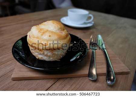 A cup of Coffee with bread on table in the morning