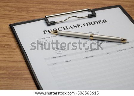 Close up of purchase order form with pen  / selective focus