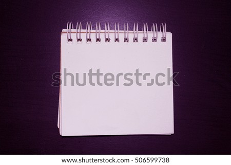 white  paper on background purple  wood