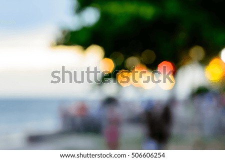 Blurred picture of crowd and tree in the background at Bangsan beach in Thailand.