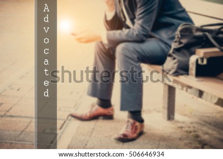 Hand writing advocated with the abstract background. The word advocated  represent the action in business as concept in stock photo.