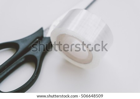 scissors and tape on a white background. office equipment for work