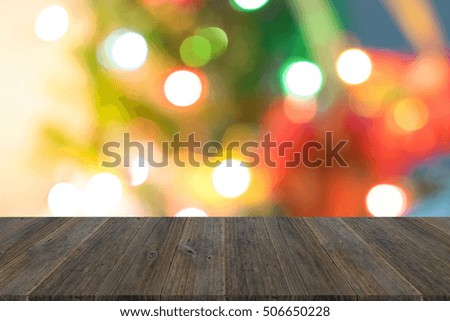 Abstract bokeh background of light for merry christmas Xmas and happy new year , process in soft orange sun light style with wood terrace