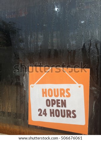 24 Open Hours Signage at Front Door of a Restaurant 