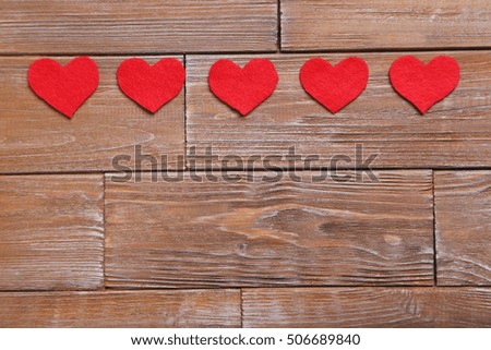 Love hearts on a brown wooden table