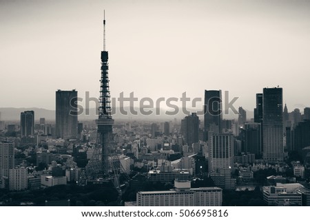 Tokyo Tower and urban skyline rooftop view at sunset, Japan.