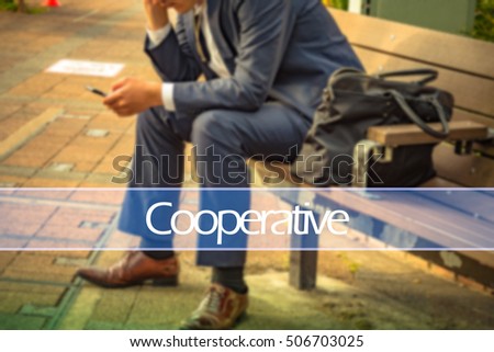 Hand writing cooperative  with the abstract background. The word cooperative   represent the action in business as concept in stock photo.