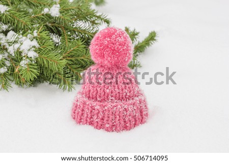 Knitted hat and Christmas tree branches. Christmas decorations. New Year.

