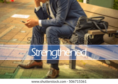 Hand writing strengthened with the abstract background. The word strengthened  represent the action in business as concept in stock photo.