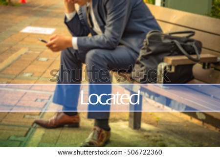 Hand writing located with the abstract background. The word located  represent the action in business as concept in stock photo.
