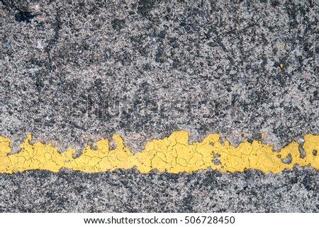 Road texture with old yellow line