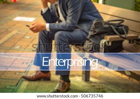 Hand writing enterprising  with the abstract background. The word enterprising   represent the action in business as concept in stock photo.