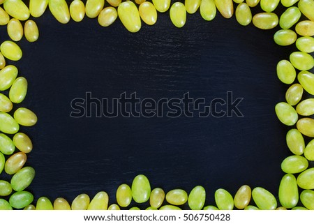 the bunch of grapes on a black background