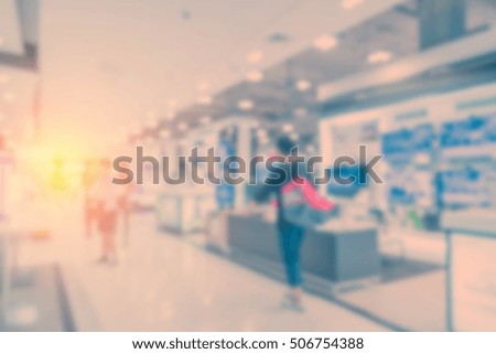blur background image of shopping mall or department store with bokeh and people background usage concept
