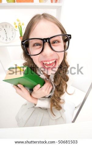 wideangle distorted picture of funny girl with green book