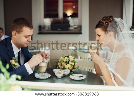 young lovers drinking coffee in a beautiful place