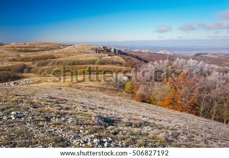 Top of the mountain in autumn. Beautiful landscape with colorful trees. 
