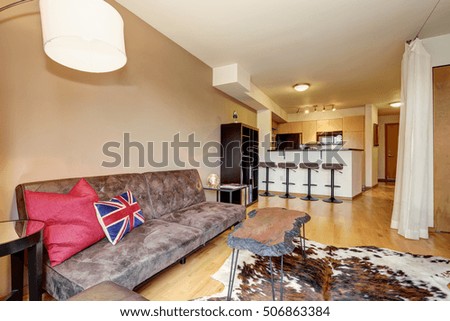 Apartment interior with minimalist design of bedroom and kitchen room. Northwest, USA